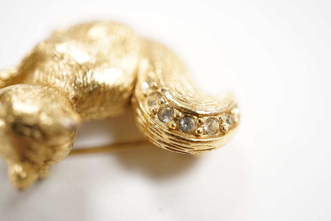 A collection of jewels, comprising: an Art Deco green and colourless paste jabot pin; two shell cameo brooches, depicting a lady in profile, length 4.7cm, stamped 9ct, and Sol's chariot respectively; and a gilt metal and